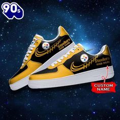 a pair of yellow and black sneakers with white soles on the bottom, in front of a galaxy background