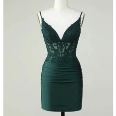 Berlinnova Us Dark Green/ Emerald Homecoming Dress With An Open Back. It Is A Corset Top With Lace And A Bottom Satin Material. It Is Size 12, Unworn/Never Used Green Mini Dress With Fitted Bodice For Prom, Dark Green Fitted Evening Dress, Green Spaghetti Strap Evening Dress For Prom, Green Mini Dress With Fitted Bodice, Elegant Green Mini Dress With Fitted Bodice, Green Sweetheart Neckline Mini Dress For Wedding, Green Mini Dress With Fitted Bodice For Evening, Green Mini Dress With Sweetheart Neckline For Wedding, Wedding Mini Dress With Sweetheart Neckline In Green