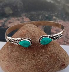 Turquoise Gemstone Bangle * 925 Sterling Silver *Handcraft Silver Bangle * Gift Item * Designer Bangle * Birthday Gift * Pear Shape Gemstone All my Designs are original. Stone - Turquoise Stone Shape - Pear Setting - Bezel This Bangle is for Women You will receive a Bangle like the one in the pictures This Bangle have 925 Stamp Suitable for use in everyday situations, or can also be used as a gift. Unique design will make a special attraction for the wearer. I make my jewelry with passion and love. The perfect gift for a Special occasion Wholesale Orders Accept on Wholesale Price All Pieces Have 925 Stamp Adjustable Turquoise Bracelet With Birthstone, Bohemian Stamped 925 Bracelet Gift, Bohemian Sterling Silver Bracelet With Gemstone For Gift, Bohemian Sterling Silver Gemstone Bracelet Gift, Bohemian Turquoise Sterling Silver Bracelet, Turquoise Birthstone Bracelet, Handmade Turquoise Sterling Silver Bracelet Gift, Turquoise Sterling Silver Bracelet Gift, Handmade Turquoise Bangle For Gift