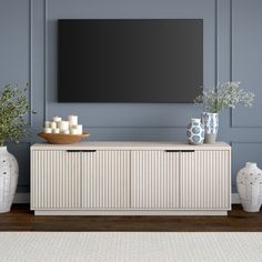 On-trend texture and design combine in this transitional TV stand. With a wood grain finish and textured fluting, this piece is sure to be a statement in your living room, den, or game room. The plinth base gives an illusion of a seamless transition from your floor, while the rounded front corners create a softer modern shape. The console features 4 fully enclosed doors with 4 inner shelves, allowing for ample storage for your devices, games, books, and more. Color: Alder White | Latitude Run® S Tv Console Decorating, Transitional Tv Stand, White Tv Stands, Living Room Tv Stand, Coastal Living Room, Modern Tv Stand, Liberty Furniture, Living Room Inspo, Living Room Tv