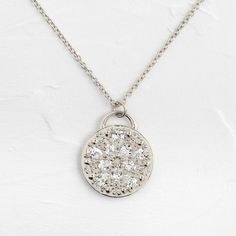 This solid 14k gold pendant is 19.5mm in diameter and 2mm thick. Also available in platinum.It features ten pear cut diamonds (3x4-3x5mm) and ten round white diamonds (1-1.5mm). All accent diamonds are SI clarity and G+ color.The pendant is available on its own or with a 20" cable chain that matches your choice of metal: solid 14k gold or platinum.We handcraft each piece with responsibly sourced metals and ethically sourced stones. Silver Pendant Necklace With Single Cut Diamonds, Silver Teardrop Diamond Necklace With Dazzling Style, Silver Solitaire Necklace With Single Cut Cubic Zirconia, Silver Pendant Diamond Necklace With Rose Cut Diamonds, Silver Rose Cut Diamond Pendant Necklace, Silver Diamond Necklace With Rose Cut Pendant, Silver Diamond Pendant Necklace With Rose Cut, Dazzling Silver Teardrop Diamond Necklace, Oval Diamond Pendant Necklace With Rose Cut