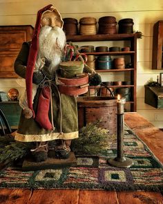 an old fashioned santa clause figurine on top of a table