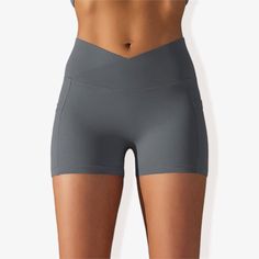 The Anna-Kaci Women's V-Cross Front Wide Band Biker Shorts are a stylish and functional addition to your activewear collection. These yoga shorts feature a unique V-cross front wide band for a secure and flattering fit. Made with 4-way stretch fabric, they offer maximum flexibility and comfort during any activity. The side pocket detail provides practical storage for essentials, while the side panel design adds a trendy touch. Perfect for yoga, workouts, or casual wear, these biker shorts combin Versatile Activewear With Built-in Shorts For Outdoor, Versatile Activewear With Built-in Shorts For Outdoor Activities, Short Activewear For Outdoor Activities, Short Solid Activewear For Outdoor Activities, Compression Activewear Shorts With Pockets, Solid Color Short Activewear For Outdoor Activities, Functional Biker Shorts With Pockets, Yoga Activewear With Pockets Mid-thigh Length, Compressive Yoga Shorts With Pockets