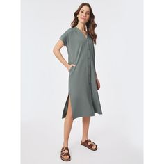 This dress is the best of both worlds: it transforms from a classy button-up style to a casual tunic. The Odera Cuff Sleeve Dress is a straight-shaped dress designed with a button placket cuff sleeves and flattering v-neck. The versatile nature of the dress allows you to style it in multiple ways â€” you can wear it buttoned as a dress or opened as a topper over shorts or pants. And with a bold green shade on soft fabric the Odera Cuff Sleeve Dress will will soon be your new go-to! Our Odera Dre Casual V-neck Shirt Dress With Placket, Casual Summer Maxi Dress With Button Cuffs, Casual Green Midi Dress With Buttons, Relaxed Fit Casual Maxi Dress For Work, Casual Maxi Dress With Button Cuffs, Green Button-up Casual Midi Dress, Casual Green Button-up Midi Dress, Versatile Spring Daywear Dresses, Versatile Daywear Dresses For Spring