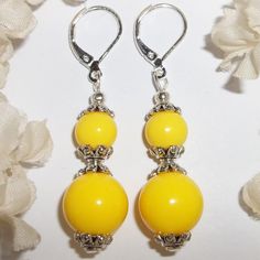 This Brand New With Tags Beaded Earring Set Was Handmade By Me With Yellow Acrylic Beads. The Pair Also Have Silver Toned Costume Jewelry Beads That Were Antiqued In Black. They Dangle & Drop From 925 Sterling Silver Lever Backs For Women's Pierced Ears. Measure 2 Inches Tall & 1/2 Inch Wide. Each Single Earring Weighs 2.7 Grams. Perfect Fashion Accessory For When You Need A Bold Pop Of Color. You Will Look Amazing Wearing Them. Grab Them Before Someone Else Does Leverback Xl Statement Bright L Elegant Yellow Beaded Earrings, Yellow Summer Jewelry With Dangling Beads, Summer Yellow Jewelry With Dangling Beads, Yellow Jewelry With Ear Wire For Party, Yellow Round Bead Jewelry For Summer, Yellow Round Beads Jewelry For Summer, Party Jewelry With Yellow Ear Wire, Yellow Ear Wire Party Earrings, Elegant Yellow Beaded Earrings For Gift