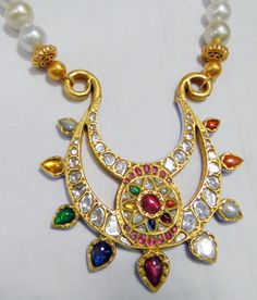 Vintage antique 23 K solid gold and natural Navratna gemstones set large pendant strung together with pearls and gold beads. Great one of type collection piece in very good condition. Length-Free size, Size of pendant-10/9 cm, gross weight-137 grams, pendant weight only-76 grams, Material-23 K gold, Natural uncut Diamonds, and Natural Navratna gemstones. Traditional Multicolor 22k Gold Necklaces, Traditional Multicolor 22k Gold Necklace, 22k Gold Multi-stone Temple Jewelry Necklace, Traditional Gold Multi-stone Necklace, 22k Gold Multi-stone Temple Necklace, Handmade Pearl Necklace For Festivals In Temple Style, Handmade Pearl Temple Necklace For Festivals, Handmade Temple Jewelry Pearl Necklace For Festivals, Gold Multi-stone Kundan Temple Necklace