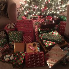 many wrapped presents under a christmas tree