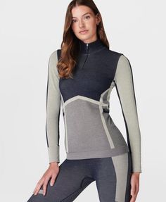 Our high-performance base layer for on and off the slopes. Soft, seamless fabric is anti-bacterial and heat-regulating to keep you warm. Part of our innovative HeatProtect collection with a ‘Base’ rating for temperature-regulating and sweat-wicking protection in all elements. Flattering slim fit with contouring seamlines and a half zip. Features jacquard Sweaty Betty logo on the back. Front length: 61cm / 21". Model wears size S and is 178cm/5'10" tall. Style Code: SB9970Colour: Navy Blue Thermal Base Layer, Base Layer Women, Womens Thermal, Layered Long Sleeve, Layer Top, Sweaty Betty, Running Jacket, Long Crop Top, Casual Coat