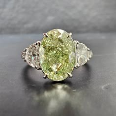 3.55 Carat GIA Fancy Light Brownish Greenish Yellow Oval Cut Diamond VVS2 Clarity 0.60 Carat Half Moons Handmade in 18k White Gold GIA Certified Half Moon Side Stones, Colored Diamond Engagement Rings, Fancy Yellow Diamond Ring, Fancy Color Diamond Ring, Oval Cut Diamond Rings, Green Diamond Rings, Colored Diamond Jewelry, Green Diamonds, Half Moons