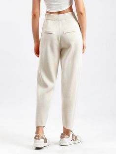 F00213013-100 Chic High-waisted Solid Sweatpants, Chic Solid Color Sweatpants, Ankle-length Pants With Ribbed Waistband, Beige Pants With Ribbed Waistband For Spring, Casual Beige Bottoms With Ribbed Waistband, Chic Trousers With Ribbed Waistband, Elegant Beige Knit Bottoms, Spring Knit Bottoms With Elastic Waistband, Casual Cream Bottoms With Ribbed Waistband