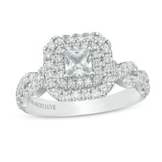 a white gold engagement ring with an square cut diamond surrounded by round brilliant pave diamonds