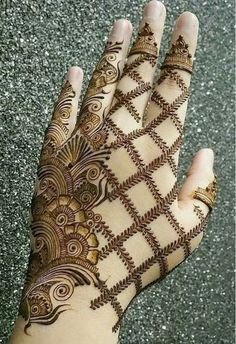 the hand is decorated with intricate designs