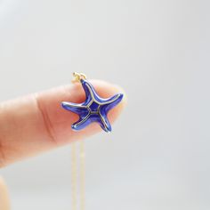 Beautiful and lovely blue starfish charm necklace.  Made of blue enamel starfish with skinny gold plated brass chain. Soft and warm. Great for gifts, everyday or special occasions. Your item will ship in a gift box. Please feel free to contact me if you have any questions. ♥ Chain length 14" - 20"  ♥ Starfish  3/4" ♥ Gold plated brass / Blue enamel ♥  See more Rudiana Accessories  Rudiana.etsy.com Blue Starfish Charm Necklace, Blue Star Shaped Necklace For Gift, Blue Star Charm Necklace As A Gift, Blue Star Charm Necklace As Gift, Blue Necklaces With Starfish Charm For Gifts, Blue Star Charm Necklace For Gift, Blue Necklace With Star Charm As A Gift, Blue Star Charm Jewelry As Gift, Blue Star Charm Jewelry For Gift