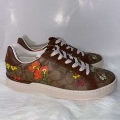 Coach Clip Low Top Sneaker In Signature Canvas With Floral Print New In Box Size 9 100 % Authentic Signature Coated Canvas And Leather Upper Fabric Lining And Footbed Rubber Outsole Lace-Up Closure Smoke And Pets Free Brown Cushioned Sneakers For Spring, Orange Cushioned Sneakers For Spring, Brown Low-top Sneakers For Spring, Brown Lace Sneakers For Spring, Brown Synthetic Sneakers For Spring, Spring Orange Cushioned Sneakers, Spring Slip-on Brown Sneakers, Brown Synthetic Spring Sneakers, Brown Lace-up Sneakers With Embroidered Logo