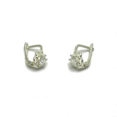 Sterling silver earrings with 3.5mm round CZ - E000652. Stamped 925. Approximate weight 1.2 grams. Dimensions 1.0x0.7cm (0.40x0.28inches). All our jewels are made from solid sterling silver 925/1000 and are carefully crafted by hand in our family workshop. We dispatch your orders in 5 working days, worldwide and the postage is $5. We ship registered priority mail. Please allow 5-7 working days for delivery in Europe and 10-15 working days outside Europe. For any questions - please do not hesitat Dainty Silver Diamond Earrings For Formal Events, Silver Sterling Cluster Earrings With Prong Setting, Silver Hallmarked Round Cluster Earrings, Sterling Silver Huggie Earrings With Lever Back For Anniversary, Anniversary Huggie Earrings With Lever Back In Sterling Silver, Silver Huggie Earrings With Cubic Zirconia, Silver Dainty Hoop Earrings For Formal Events, Dainty Silver Hoop Earrings For Formal Events, Dainty Silver Hoop Earrings For Formal Occasions