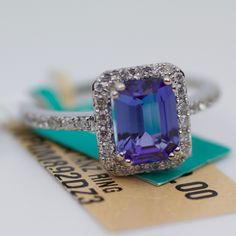 Effy 14k White Gold Emerald Cut Tanzanite With Round Round Diamond Ring 3.1 Grams Ring Size 7.25 Round White Diamonds Emerald Cut Tanzanite 8x6mm This Is A Beautiful New Effy Ring That Showcases This Stunning Tanzanite. The Ring Is Stamped And Is Absolutely Brand New With Tags Still Attached. The Retail On This Is $3,499 But You Can Get It For Half Of Retail! If Any Of The Tags Are Removed The Item Is Non Refundable! If You Have Any Questions Or Concerns Please Do Not Hesitate To Ask. Tanzanite Stackable Ring, 2 Carat Tanzanite Ring, Tanzanite And Tourmaline Ring, Tanzanite Rings Unique, Effy Tanzanite Rings, Effy Ring, Effy Rings, Tanzanite And Diamond Ring, Dream Rings