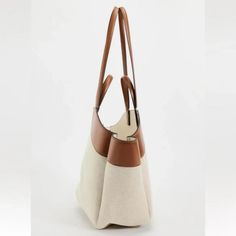 Mixed Tote Bag. Canvas Fabric Exterior. Handles And Shoulder Straps. Magnetic Closure. Height X Length X Width: 19.7 X 12.2 X 5.1 Inches (50 X 31 X 13 Cm) Dark Tan Luxury Beige Bucket Bag For Errands, Tan Leather Handle Bucket Shoulder Bag, Chic Beige Hobo Bag With Leather Trim, White Canvas Bucket Bag For Errands, Chic Hobo Bag With Leather Trim For Daily Use, Beige Leather Bucket Bag For Errands, Luxury Beige Hobo Tote Bag, Tan Bucket Bag With Leather Handles, Chic Bucket Bags With Leather Trim