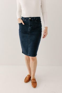 Every woman needs a classy denim skirt in her life! The 'Krista' gives denim an elegant twist with it's straight pencil style and solid dark wash shade. Plus, we love the subtle stretch which will keep you comfortable all day long! Pair the 'Krista' with a turtleneck sweater and boots for a day shopping with friends or with a floral blouse and loafers for the office. Exclusively designed with you in mind. 97% Cotton 3% Spandex Machine Wash Cold Do Not Bleach Hang to Dry Low Iron if Needed 2" Bac Shopping With Friends, Denim Pencil Skirt, Layered Tops, Low Iron, Skirt Leggings, Blouse Dress, Tops For Leggings, Floral Blouse, Every Woman