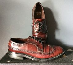 Nicely broken in with lots of wear left, these classic Wingtips are US made vintage quality. They are a Cordovan leather with stitched leather soles and stacked rubber 1 1/8" heel. They are marked a size 9D. The ball of foot measures 4 3/8", 12 1/2" long heel to toe measurement. Nunn Bush brand. Vintage Oxfords With Leather Footbed For Work, Fitted Vintage Oxfords For Derby, Vintage Brown Oxfords With Stitched Sole, Vintage Leather Oxford Shoes For Work, Vintage Brown Oxford Leather Shoes, Vintage Leather Oxfords For Work, Vintage Wingtip Leather Shoes With Stitched Sole, Vintage Leather Wingtip Shoes With Stitched Sole, Vintage Fitted Brogue Oxfords