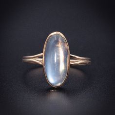 A stone believed to aid in new beginnings, Moonstone is also attributed with inner growth and emotional stability. A stone connected with intuition and femininity, it has been admired for centuries. Converted from an antique cufflink using an antique stick pin to make the shank, this beauty has a simple elegance and a mesmerizing oblong moonstone. Wear this ethereal gem anywhere-she looks just as fabulous with jeans and a tee as she does with a black velvet dress! Details (approximate) Size: 6.5 Dimensions: Ring top is 1.2 cm at widest point. Weight: 1.7 grams Materials: Gold, Moonstone Metal: 14K yellow gold Marks: Marked 14K, SW on original element. Condition: Very good converted antique condition commensurate with age. This piece can be resized, resize options are $25 more than the base Antique 14k Gold Moonstone Wedding Ring, Antique 14k Gold Moonstone Ring Gift, Timeless Sterling Silver Moonstone Ring, Oval Hallmarked 14k Gold Moonstone Ring, Heirloom Oval Moonstone Ring, Timeless Moonstone Gemstone Ring As Gift, Timeless Moonstone Gemstone Ring For Gift, Collectible Oval Cabochon Moonstone Ring, Timeless Moonstone Ring For Gift