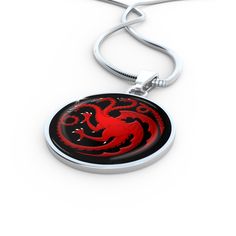 Targaryen Pendant Game of Thrones Jewelry House Targaryen Necklace Daenerys Amulet Charm size 2.5cm X 2.5cm Made in USA (New Jersey) Crafted in Stainless Steel and Shatterproof Glass Comes with Gift Box Fully Necklaces adjustable 18"-22" Bangle adjustable 8"-9" Adjustable Medallion Jewelry With Charms, Red Metal Necklace With Large Pendant, Personalized Metal Necklaces With Round Pendant, Personalized Metal Necklace With Round Pendant, Personalized Metal Round Pendant Necklace, Amulet Style Pendant Jewelry With Lobster Clasp, Amulet Pendant Jewelry With Lobster Clasp, Red Stainless Steel Pendant Jewelry, Adjustable Silver Medallion Jewelry