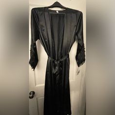 Nwt Black Flora Satin Long Robe With Lace Detail Sleeves Black Fitted Sleepwear For Wedding Night, Fitted Black Sleepwear For Wedding Night, Fitted Black Party Robe, Black Long Sleeve Robe For Wedding Night, Black Long Sleeve Party Sleepwear, Black Satin Party Robe, Black Satin Robe For Party, Fitted Black Robe With Long Sleeves, Black Open Front Robe For Loungewear