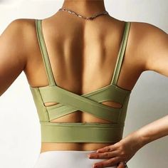 Adella Sports Bra. A comfortable fit with a sporty look for workouts, yoga or just hanging out. Pair with an item from our leggings collection. Detail: Padded/RemovableMaterial: (80%) Nylon, (20%) Spandex Green Sports Bra With Built-in Padding For Pilates, Gym Sports Bra With Built-in Padding And Stretch, Sports Bra With Built-in Padding For Yoga, Compressive Yoga Activewear With Built-in Padding, Green Sports Bra With Built-in Padding For Gym, Compression Yoga Sports Bra With Built-in Padding, Functional Activewear With Built-in Bra For Pilates, High Stretch Yoga Pants With Built-in Bra, Solid Color Activewear With Built-in Padding For Yoga