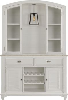 a white china cabinet with glass doors and shelves