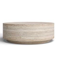 a round stone table with a white background