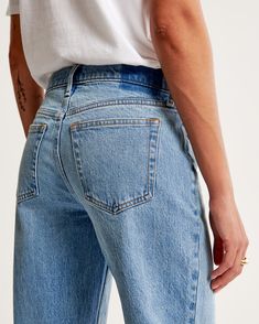 Our classic low rise baggy jeans in a medium wash with a raw hem. This fit features a 8.5” low rise, is slightly relaxed at waist and hips, and eases at the thigh into a baggy, full-length leg shape. We recommend buying your true size for a baggier fit. Size down for a closer fit. This jean is made from our vintage stretch fabric which features both an authentic vintage look and contains slight built-in stretch for additional comfort. Classic Washed Blue Rigid Denim Flare Jeans, Classic Washed Blue Flare Jeans, Classic Relaxed Fit Washed Blue Jeans, Classic Medium Wash Rigid Denim Flare Jeans, Everyday Medium Wash Flare Jeans With Frayed Hem, Classic Blue Relaxed Fit Cropped Jeans, Blue Classic Cropped Jeans Relaxed Fit, Mid-rise Medium Wash Flare Jeans For Everyday, Classic Medium Wash Denim Flare Jeans