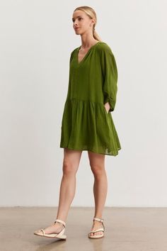 A woman in a green Sheer Sleeve Green Dress, Cotton Dress Green, Sheet Sleeve Dress, Gauze Clothing, Velvet Tees, Cami Shirt, Like Green, Gauze Dress, Linen Shop