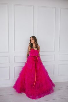 This hot pink princess dress will make you feel like you stepped straight out of a fairy tale. With its floor length and voluminous design,  it's perfect for any romantic occasion, from weddings to proms.  The small velvet belt and bow ties add unique and beautiful touches,  making you look and feel majestic.  (No awkward pumpkin coach rides here.) Message me for any kind of customizations. Pink Bridesmaid Gown For Prom Season, Princess Quinceanera Dress With Ruffles, Pink Maxi Dress For Prom, Pink Princess Organza Gown, Princess Quinceanera Ball Gown With Ruffles, Pink Tulle Ball Gown For Prom Season, Pink Organza Ball Gown Evening Dress, Pink Floor-length Wedding Dress For Prom Season, Pink Tulle Ball Gown For Prom