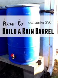 two large blue barrels sitting next to each other in front of a white house with the words how to build a rain barrel