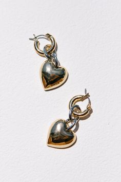 These puffed heart hoops are 1.5" gold huggie hoop earring, with a silver rhodium chain and gold heart drop. They feature a latch-back closure and are lead, nickel, and cadmium free! Puffed Heart, White Dress Party, Bridesmaids And Groomsmen, Heart Drop Earrings, Girls Dresses Summer, Shoe Gifts, Mens Accessories Jewelry, Hair Accessories Jewelry, Sock Shop