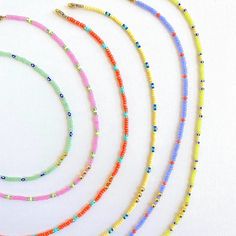 These are out most popular seed bead necklaces! With tons of cute colors and patterns, the possibilities are endless! They make a great special gift for friends and family! Its fun to pair multiple styles and lengths🤍 I hope you love them! 🤍Gianna Tiny Yellow Beads For Summer, Trendy Handmade Yellow Beaded Necklace, Summer Heishi Bead Jewelry With Tiny Beads, Minimalist Beaded Necklaces With Colorful Beads For Summer, Minimalist Tiny Beads Necklace For Summer, Trendy Yellow Necklace With Tiny Beads, Minimalist Summer Beaded Necklace With Tiny Beads, Summer Minimalist Beaded Necklace With Tiny Beads, Summer Heishi Beads Necklace With Spacer Beads