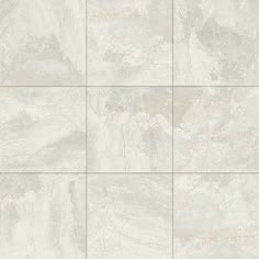 a white tile wall with grey and gray tiles on the bottom, in different shades