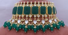 Green Bridal Choker Necklace Jhumka Earrings Jewelry Set, South Bridal Jewelry Set, Kundan Punjabi Jewelry Set, High Quality Jewelry Set For the classy women out there 😍😍 One piece of jewelry that is full of royal Opulence and Style ITEM DESCRIPTION Metal        = Gold Plated Occasion  = Wedding, Party Wear, Bridal Color        =   Green and Gold Size          = Necklace Length = 8 Inches Long, Earring Size = 2.5 Inches Long,  Designer Latest Big Kundan Necklace Earrings Set Free Shipping Elegant Green Kundan Necklace With Latkans, Green Jewelry With Latkans For Diwali, Green Jewelry With Latkans For Festivals, Green Dangle Jewelry For Diwali, Elegant Green Cutdana Jewelry, Elegant Green Jhumkas As Gift, Green Dangle Bollywood Style Jewelry, Green Bollywood Style Dangle Jewelry, Green Meenakari Dangle Jewelry