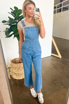 Details: Looking for a unique take on overalls? Look no further than our Mineral Washed Knot Strap Overalls! These overalls feature adjustable straps with a playful knot detail, giving them a relaxed fit that's perfect for any occasion. With a washed finish, you'll stand out in the best way possible. Plus, the relaxed fit means you'll be comfortable all day long! - Denim- Pockets - Relaxed fit Content: 80% Cotton 18% Polyester 2% Spandex. Size + Fit: Model is 5'8" and wearing a Small - Measureme Overalls Disney Outfit, Overalls No Shirt, Women’s Overalls, Wide Leg Overalls Outfit, Jean Overalls Outfit, Blue Overalls Outfit, Long Overalls Outfit, Summer Overall Outfits, Overalls Outfit Fall