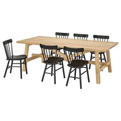 a wooden table with black chairs around it