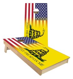 a cornhole game with an american flag and the image of a snake on it