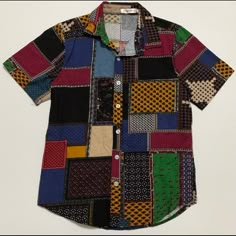 Amazing Patchwork-Like Button Down Shirt. Tagged Size Large, But More Like A Men’s Small!! Would Be An Amazing Shirt To Wear Tied Into A Crop Top Short Sleeve Men’s Small All Buttons Intact Measurements: Top Of Collar To Bottom Of Shirt: 27 1/4” Shoulder To Shoulder: 15” Arm Hole: 6 5/8” Cheap Playful Button-up Shirt, Memory Crafts From Clothes Shirts & Tops, Affordable Playful Button-up Shirt, Cheap Multicolor Print Patchwork Tops, Casual Patchwork Patterned Shirt, Colorful Button Up, Casual Patterned Shirt With Buttons, Multicolor Cotton Tops With Buttons, Multicolor Cotton Top With Buttons