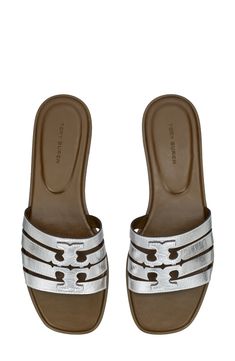 A dimensional Double-T logo stands out atop the strappy vamp of this breezy leather slide sandal. Leather upper and lining/rubber sole Imported Luxury Slide Sandals With Leather Footbed, Designer Slide Sandals With Cushioned Footbed, Tan Leather Footbed Slip-on Sandals, Silver Leather Slides For Summer, Designer Slides With Leather Footbed And Flat Heel, Silver Slides With Leather Footbed, Silver Slides With Leather Footbed For Summer, Luxury Tan Sandals With Leather Footbed, Silver Slides With Removable Insole