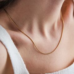 SNAKE - CHAIN - NECKLACE Introducing our exquisite Snake Chain Necklace, crafted with 18K gold and designed for women and unisex wear. This versatile piece features a waterproof design, making it perfect for everyday wear. Whether it's a Mother's Day Gift, a Valentine's Day treat, or a thoughtful Gift For Her, this gold-filled chain adds a touch of elegance to any outfit. Ideal for him or her, it's the perfect accessory to elevate any ensemble. Shop now and add this timeless gold snake chain to Classic Herringbone Necklace With Delicate Chain For Gift, Gold Snake Chain Necklace Gift, Delicate Yellow Gold Herringbone Necklace Gift, Yellow Gold Herringbone Necklace With Delicate Chain, Yellow Gold Herringbone Necklace With Delicate Chain As Gift, Gift Yellow Gold Herringbone Necklace With Delicate Chain, Minimalist Herringbone Necklace With Box Chain As Gift, Gift Delicate Herringbone Necklace In Yellow Gold, Minimalist Snake Chain Necklace For Gift