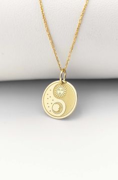 Welcome to ElegantGoldJewels,  Find all the information you need about your charm: Material of pendant: 14K Solid Gold Stamp: 585 (14K) Thickness: 0.5mm Jumpring Diameter: 4mm The pendant is available in 6 sizes: - 13mm / 0.52 inches - 15mm / 0.59 inches - 18mm / 0.70 inches - 20mm / 0.78 inches - 22mm / 0.86 inches - 24mm / 0.94 inches - 26mm / 1.02 inches - 28mm / 1.10 inches - 30mm / 1.18 inches Chains Information: Rolo Chain: -14K Real Gold - 0.70mm thick - Spring Ring Clasp - 16 inches / 40 Spiritual Round Moon Charm Necklace, Celestial Sun And Moon Charm Necklaces, Celestial Sun And Moon Charm Necklace, Spiritual Round Moon Phase Charm Necklace, Sun And Moon Design Charm Necklaces, Necklace Sun And Moon, Yin Yang Jewelry, Sun Moon Necklace, Sun And Moon Pendant