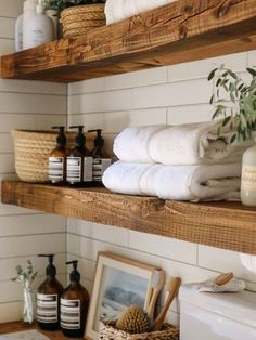 bathroom shelves filled with towels and other items