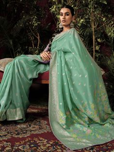 Introducing our exquisite "pretty teal green zari weaving silk festival wear saree with blouse" - the perfect outfit to make a statement at any festive occasion. This stunning teal-green silk saree features intricate sequin and embroidered work that adds a touch of elegance and charm to your look. Paired with a pink silk blouse with zari weaving work, this saree set is sure to turn heads wherever you go.
The 5.50-meter saree and unstitched blouse material allow for customization and a perfect fi Green Slub Silk Set For Festivals, Festive Green Slub Silk Traditional Wear, Green Slub Silk Blouse Piece With Zari Work, Green Cotton Silk Blouse Piece With Dupatta, Green Semi-stitched Cotton Silk Traditional Wear, Green Cotton Silk Blouse Piece With Traditional Drape, Green Slub Silk Blouse Piece With Cutdana, Green Slub Silk Traditional Wear For Wedding, Green Cotton Silk Traditional Wear For Diwali