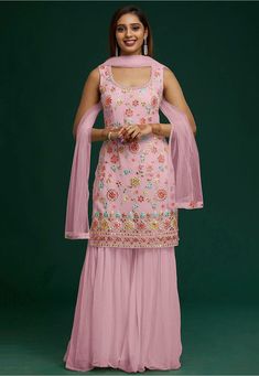 Semi-stitched Faux Georgette Pakistani Suit in Pink This Round Neck and Sleeveless attire with Poly Shantoon Lining is Prettified with Mirror Effect, Resham, Stone and Patch Border Work Available with a Faux Georgette Sharara and a Net Dupatta in Pink The Kameez and Bottom Lengths are 40 inches respectively Do note: The Length may vary upto 2 inches. Accessories shown in the image are for presentation purposes only.(Slight variation in actual color vs. image is possible). Sharara Suit Wedding, Pakistani Sharara Suit, Sharara Design, Sharara Style, Pakistani Sharara, Pink Sharara, Suits For Women Indian, Georgette Sharara, Red Lehenga Choli