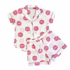 "Celebrate your Phi Mu sisterhood!  Every single print has been block printed by HAND by our amazing artisans and each pajama is individually sewn. These short sleeve / shorts are amazingly comfy and adorable all at the same time.  Details such as the piping and pockets make these pajamas perfect to lounge in, sleep in, or just about do anything in!   100% lightweight cotton with hand block printed design True to size, shorts come with elastic waist and pockets Size US Ladies Size Bust XS 0-2 34\" S 4-6 36\" M 8-10 38\" L 10-12 41\" XL 12-14 45\"     Care & Cleaning: wash cold with like colors in delicate cycle.  Best to line dry." Cotton Pajama Shorts Matching Set For Sleep, Printed Cotton Pajama Shorts For Sleep, Printed Cotton Pajama Shorts For Bedtime, Cotton Printed Pajama Shorts For Bedtime, Cotton Printed Pajama Shorts For Sleepover, Cute Cotton Pajama Shorts With Relaxed Fit, White Cotton Pajama Shorts For Home, Cotton Sleepwear With Floral Print And Short Sleeves, Cotton Short Sleeve Pajama Party Sets