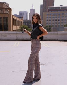 Feel classy and powerful in the Plaid About You Pants! These unique trousers are woven in a timeless plaid pattern with a sophisticated crossover button detail. The high rise and straight leg of these pants lend them a look of sharp professionalism, perfect for any office or work environment. Crafted from a soft and stretchy fabric, these elevated pieces offer year-round comfort that will make it easy to stay focused all day. This style runs small at the waistline - we recommend sizing up if bet Styling Checked Pants, Plaid Trousers Outfit Work, Plaid Office Pants, Plaid Trousers Women, Weekend Lunch Outfit, Plaid Pants Outfit Women, Trousers Outfit Work, Plaid Trousers Outfit, Unique Trousers