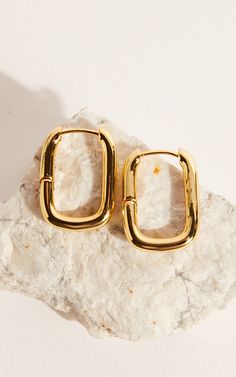 Add a touch of glamour to any outfit with our Toni Earrings in Gold. These stunning hoop earrings are perfect for both casual and party looks, making them a versatile addition to your jewelry collection. Crafted in gold, these earrings exude elegance and sophistication, while the classic hoop design adds a trendy twist.Whether you're heading out for brunch with friends or getting ready for a night on the town, our Toni Earrings are sure to elevate your style game. So go ahead and shine bright wi Trendy Gold Tarnish Resistant Clip-on Earrings, Elegant Small Hoop Gold Plated Clip-on Earrings, Trendy Gold Tarnish Resistant Earrings, Trendy Tarnish Resistant Gold Earrings, Trendy Gold Tarnish-resistant Earrings, Chic Gold Single Cartilage Earring, Trendy Tarnish-resistant Gold Earrings, Trendy Gold-tone Jewelry With Matching Earrings, Elegant Gold-tone Hoop Huggie Earrings